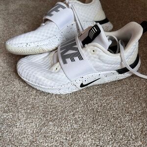 Women’s white Nike sneakers